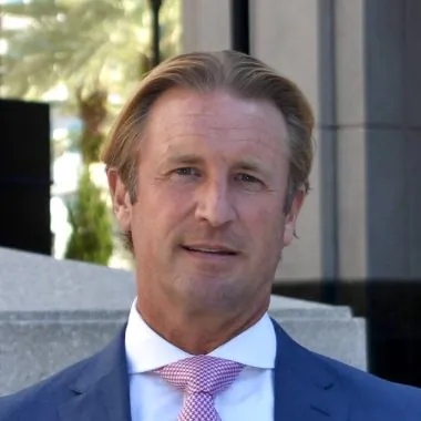 Simon Wiseman, attorney, portrait in blue suit and pink tie